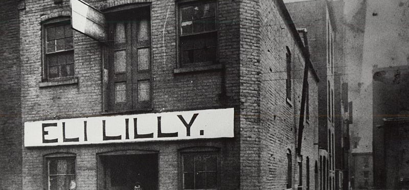 Geschäft von Eli Lilly im Jahr 1885 in Indianapolis (USA), aus dem ein global operierender Pharma-Riese wurde. Das Pharmaunternehmen muss sich regelmäßig nationalen wie auch ausländischen GMP-Inspektionen unterziehen.